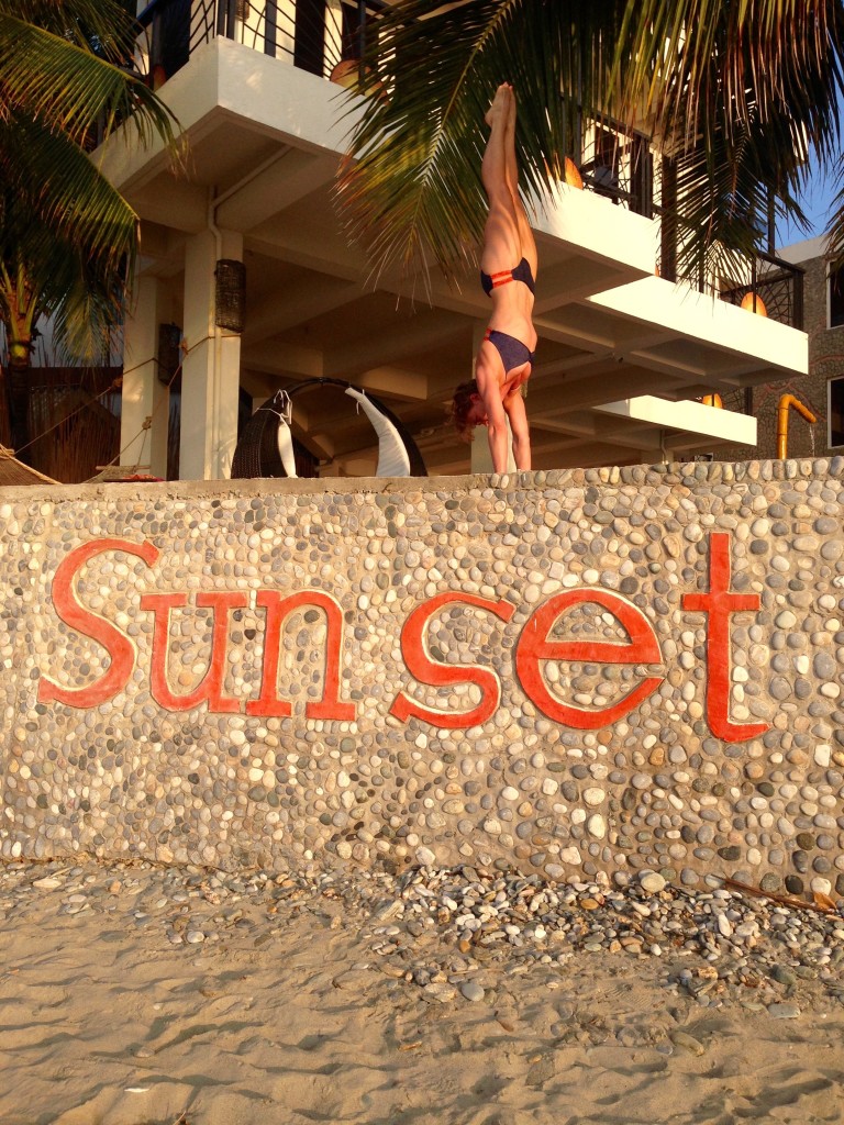 Handstand on Sunset beach wall