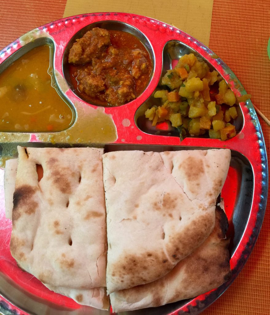 Naan with dahl, spicy potatoes & chicken curry