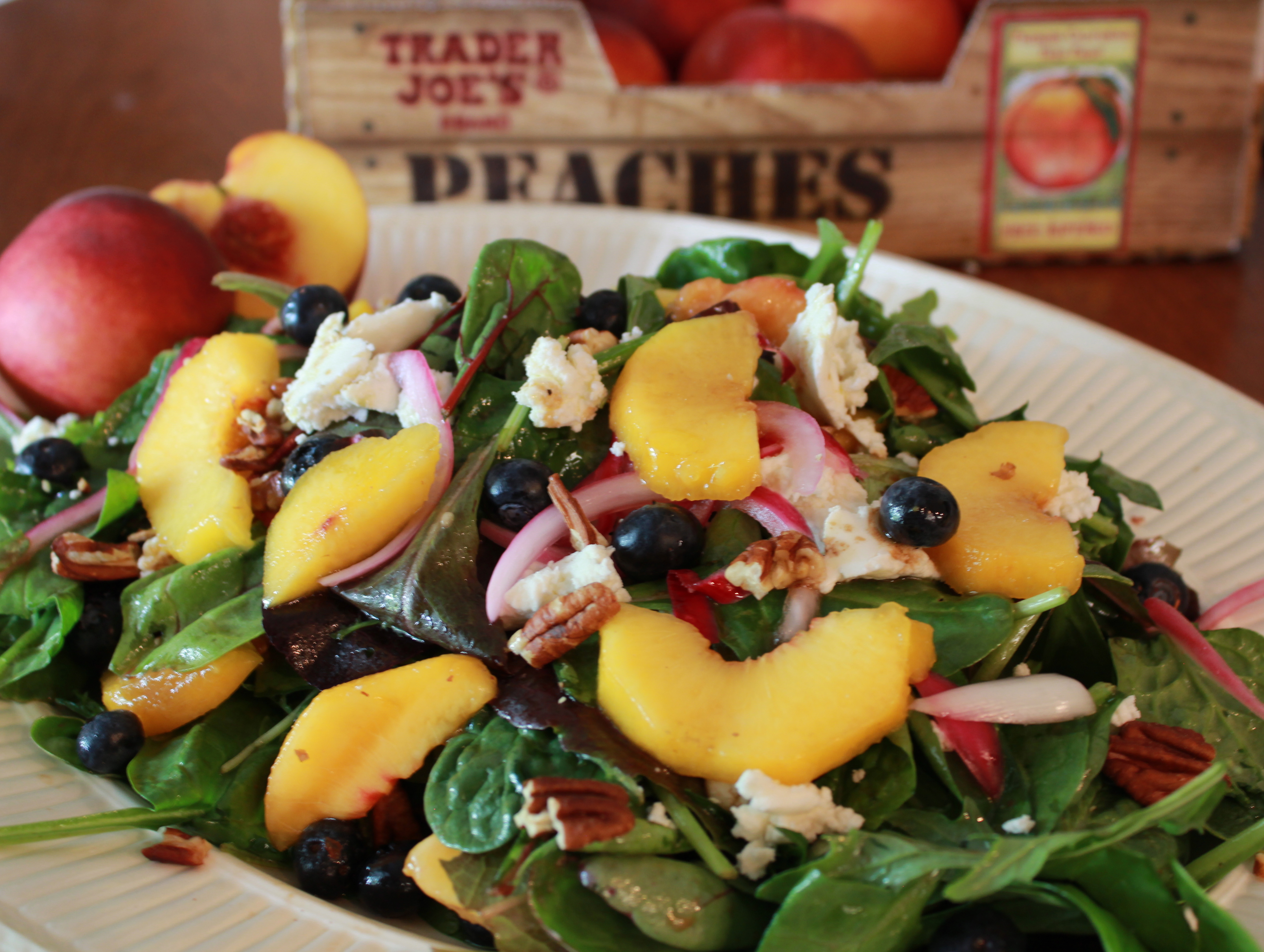 Peach & blueberry salad with goat cheese, pecans, & pickled onions