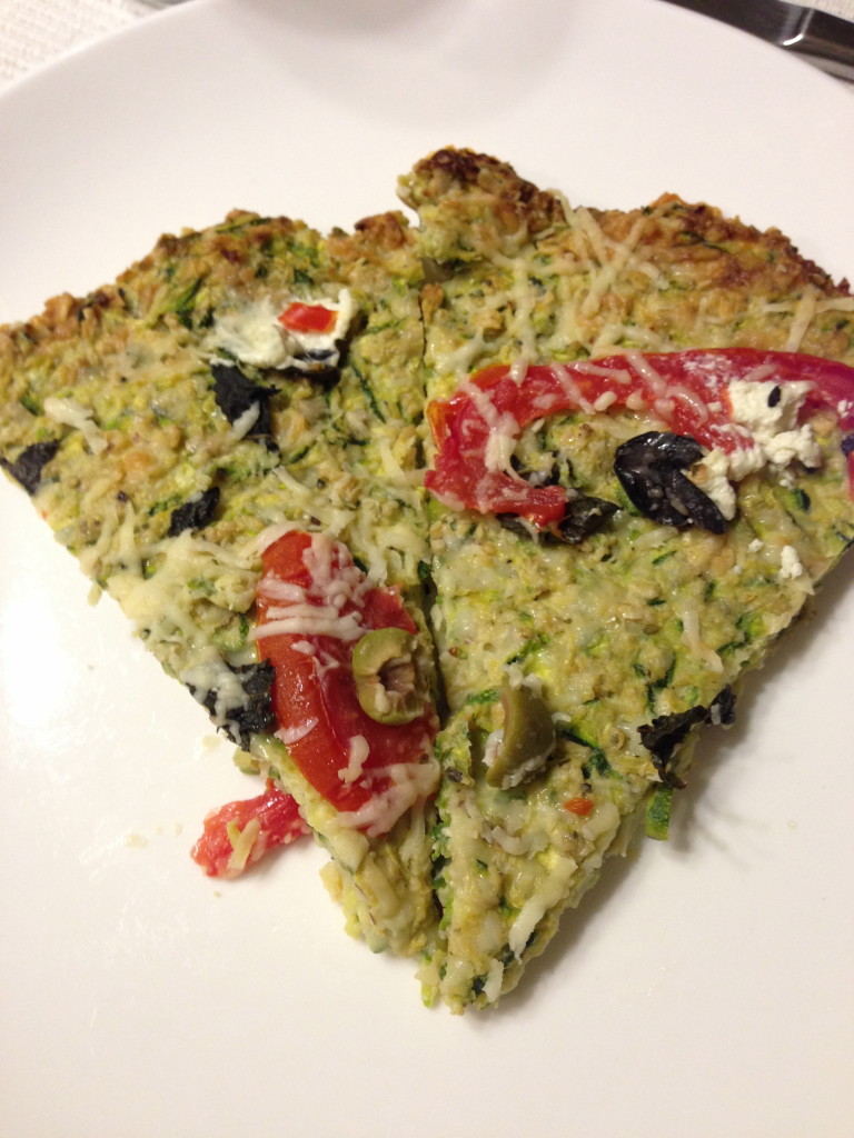 Zucchini crust pizza with fresh tomatoes & olives