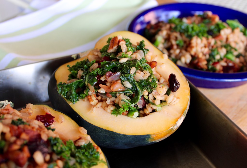 Stuffed acorn squash with barley, kale, dried cranberries & pecans