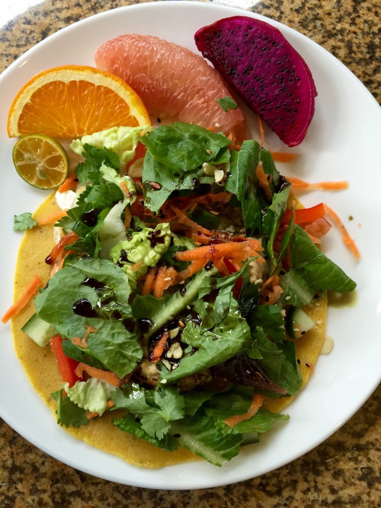 Chickpea pancake with salad, fruit