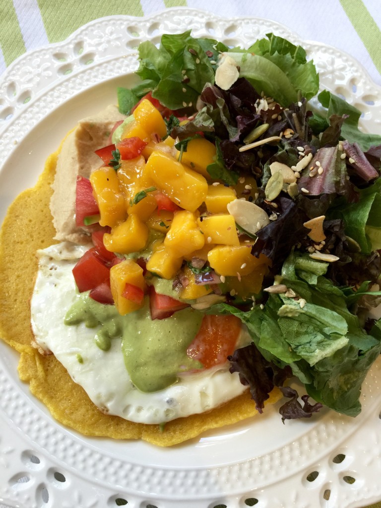 Lunch: chickpea pancake with over easy egg, hummus, mango salsa, & salad