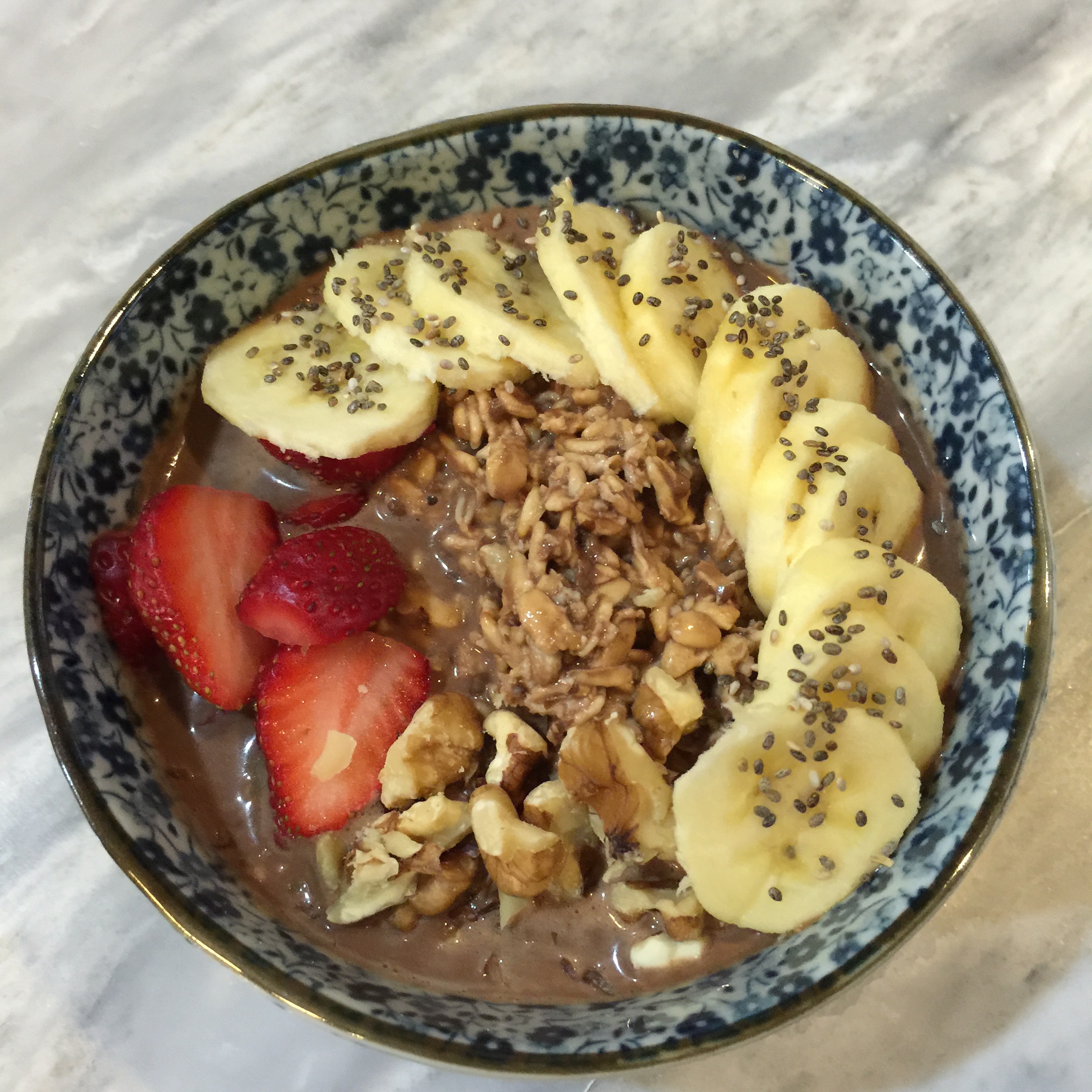 Chocolate Overnight Oats with Banana, Strawberries, Walnuts. & Chia Seeds