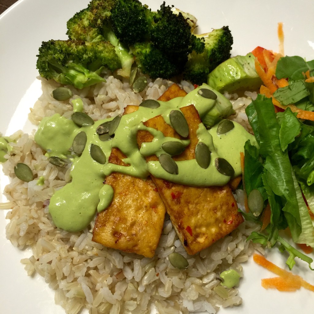 Brown rice & chili baked tofu  with cilantro cashew cream & pumpkin seeds