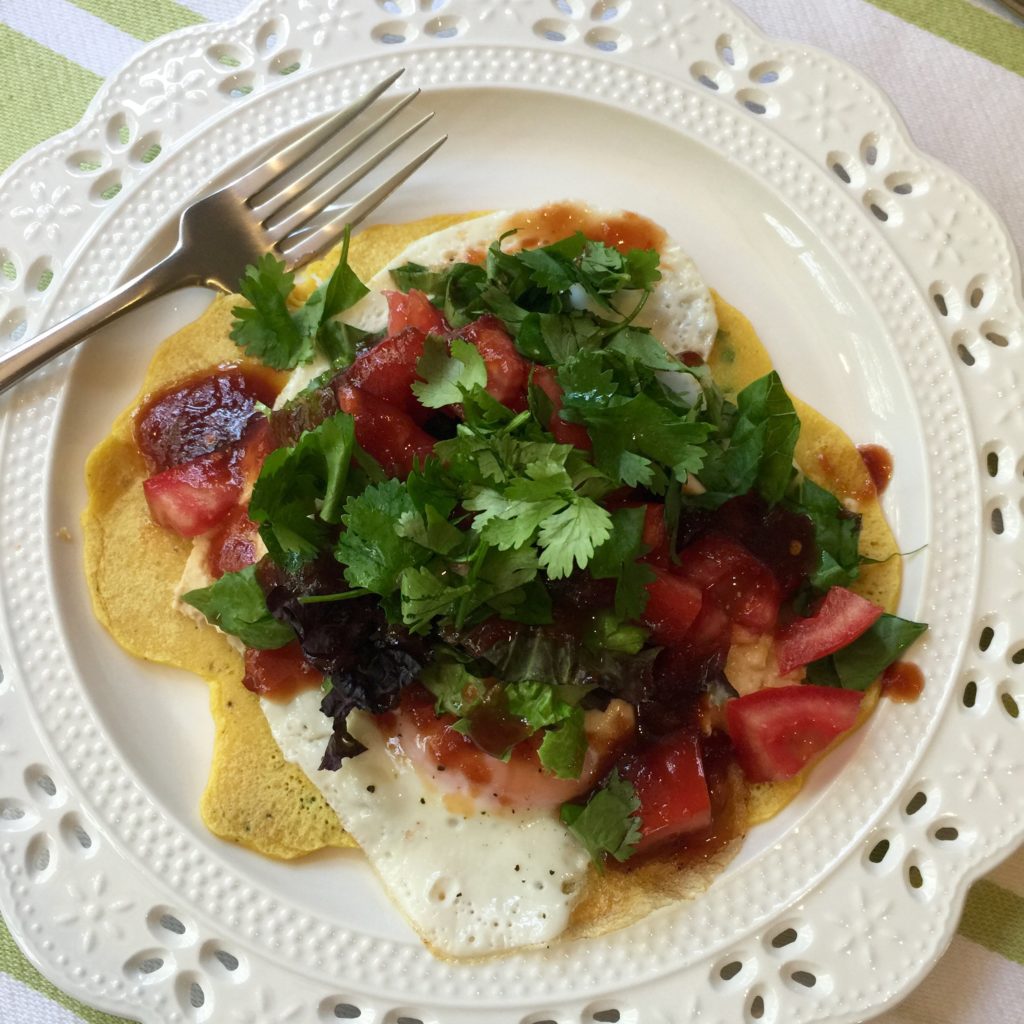 Chickpea Pancake with fried egg, hummus, salad, & tomato jam