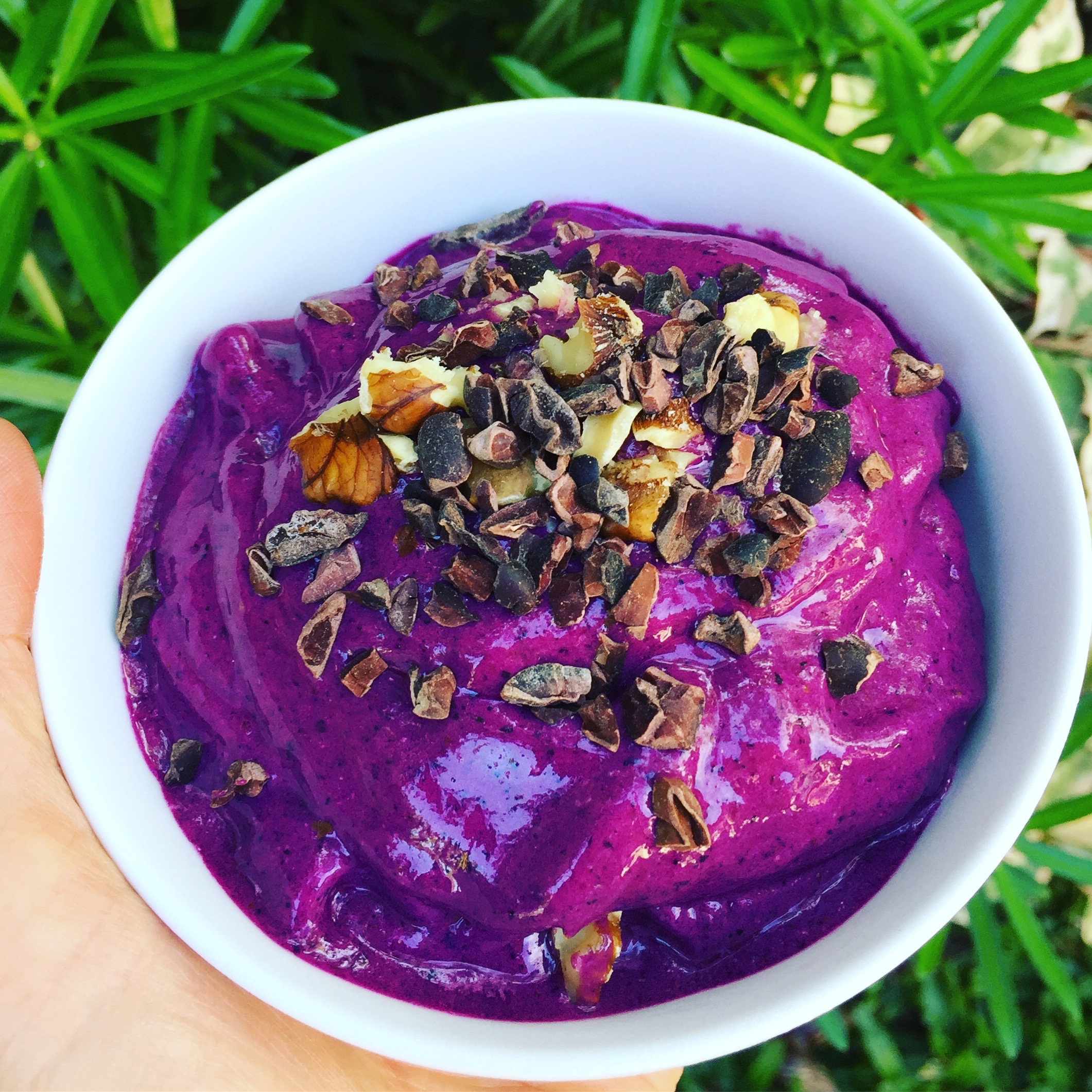 Blueberry dragonfruit smoothie bowl with cacao nibs & walnuts