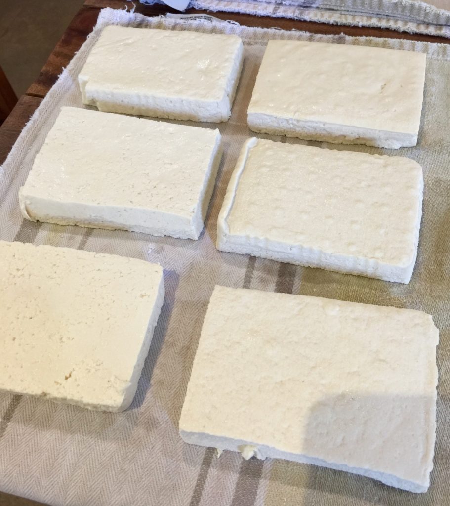 Dry your tofu between layers of kitchen towel. Press it with something heavy like cutting boards